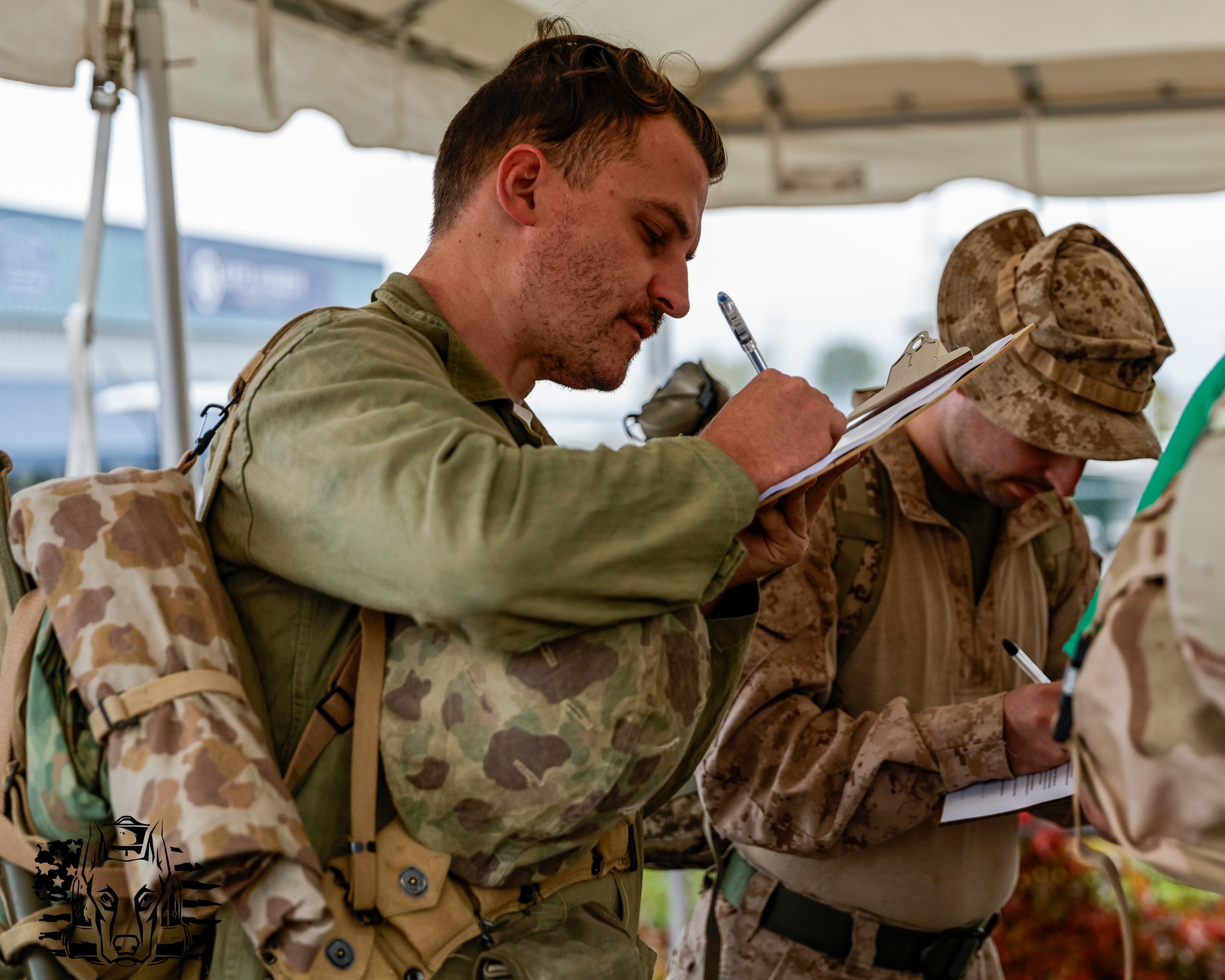 A volunteer taking notes on a clipboard